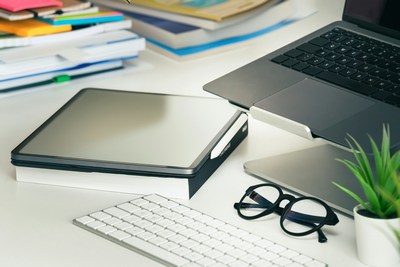 Tablets and notebook laid on table in office in Mauritius